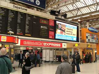 Large indoor digital LED screen at the Victoria railway station in London